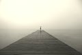 Woman with black umbrella looking infinity in a surreal place