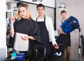 Woman blaming hairdresser in bad haircut Royalty Free Stock Photo