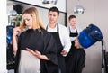 Woman blaming hairdresser in bad haircut Royalty Free Stock Photo