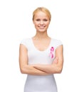 Woman in blank t-shirt with pink cancer ribbon Royalty Free Stock Photo