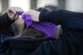 Woman blindfolds herself during a feminist flashmob in downtown Bucharest