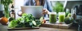 Woman blogger preparing green smoothie. Selective focus.