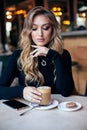 Woman with blond curly hair in elegant dress and accessories, d Royalty Free Stock Photo