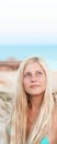 Woman with blond hair enjoying seaside and beach lifestyle in summertime, holiday travel and leisure