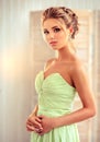 Woman with blond hair, wears in a wedding gown. Royalty Free Stock Photo