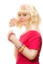 Woman in blond wig with lollipop Royalty Free Stock Photo