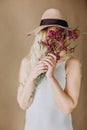 Woman blonde gray dress flowers hat Royalty Free Stock Photo