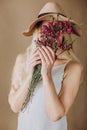 Woman blonde gray dress flowers hat Royalty Free Stock Photo