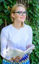 Woman blonde take break relaxing in park reading book. Bookworm student relaxing with book green nature background Royalty Free Stock Photo