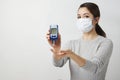 Woman with blood glucose meter, close-up