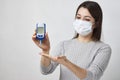 Woman with blood glucose meter, close-up