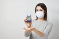 Woman with blood glucose meter, close-up