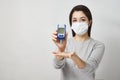 Woman with blood glucose meter, close-up