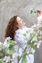 Woman among blooming apple tree Royalty Free Stock Photo