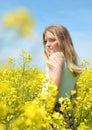 Woman on blooming rapeseed field