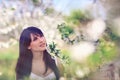 Woman in blooming trees in spring Royalty Free Stock Photo