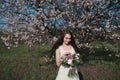 Woman in blooming trees