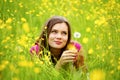 Woman blow on dandelion