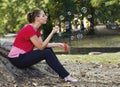 Woman blowing bubbles in park