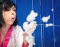 Woman blowing bubbles Royalty Free Stock Photo