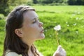 Woman Blowing Dandelion Seeds Royalty Free Stock Photo