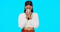 Woman, blowing nose and sick with tissue in studio for allergies, dust or pollen by blue background. Girl, sneeze and Royalty Free Stock Photo