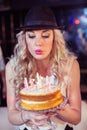 Woman blowing out candles Royalty Free Stock Photo