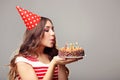 Woman blowing out candles Royalty Free Stock Photo