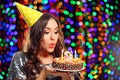 Woman blowing out candles Royalty Free Stock Photo