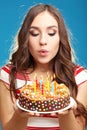 Woman blowing out candles Royalty Free Stock Photo