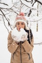 Woman blowing snow flakes Royalty Free Stock Photo
