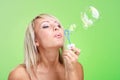 Woman blowing soap bubbles Royalty Free Stock Photo