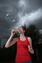 Woman blowing soap bubbles Royalty Free Stock Photo