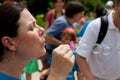 Woman Blows Bubbles As People Leave Butterfly Festival