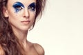 Woman with blue artistic fashion make up