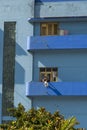 Woman on blue balcony Havana