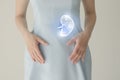 Woman in blue clothes holding virtual spleen in hand. Handrawn human organ, detox and healthcare, healthcare hospital service