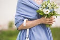 woman in blue dress holding beautiful wedding bouquet of flowers and white umbrella. Bride Royalty Free Stock Photo