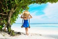 Woman in blue dress swinging at beach Royalty Free Stock Photo