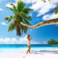 Woman in blue dress swinging at beach Royalty Free Stock Photo