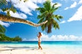 Woman in blue dress swinging at beach Royalty Free Stock Photo