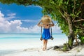 Woman in blue dress swinging at beach Royalty Free Stock Photo