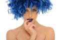 Woman in blue feathers with open eyes
