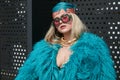 Woman with blue fur coat and golden gecko necklace before Gucci fashion show, Milan Fashion Royalty Free Stock Photo