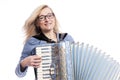 Woman in blue with glasses plays accordeon and smiles