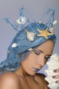 Woman with blue hair, crown and shells Royalty Free Stock Photo