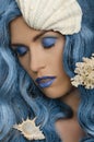 Woman with blue hair and seashells