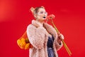 Woman with blue lips caring bag of fruits and pink flowers Royalty Free Stock Photo