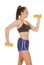 Woman blue shorts weights side one up Royalty Free Stock Photo