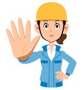 Woman in blue work clothes wearing a helmet to stop